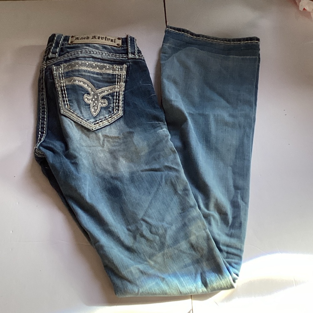 Rock Revival Light Wash Mid Rise Bootcut Jeans.